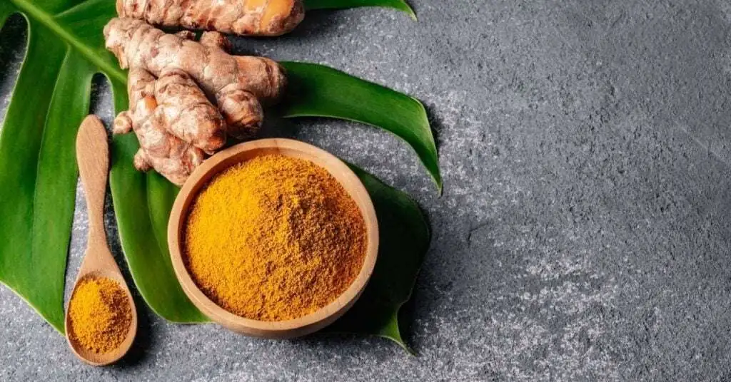 turmeric in a mini wooden bowl