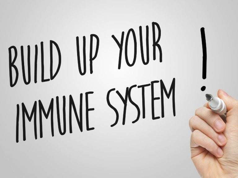 person writing immune system tips on a glass pane