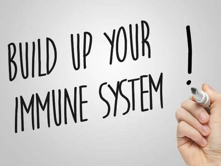 person writing immune system tips on a glass pane