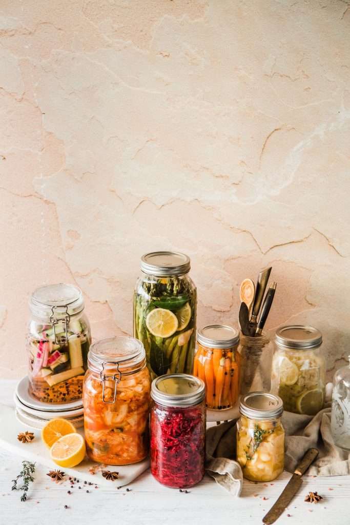 vegetables and fruits in glass jars