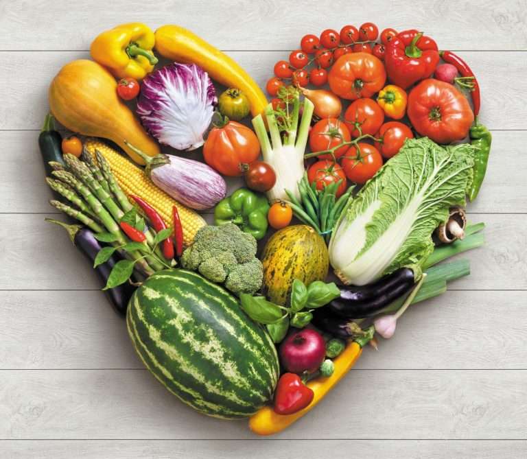 vegetables curated together in the shape of a heart