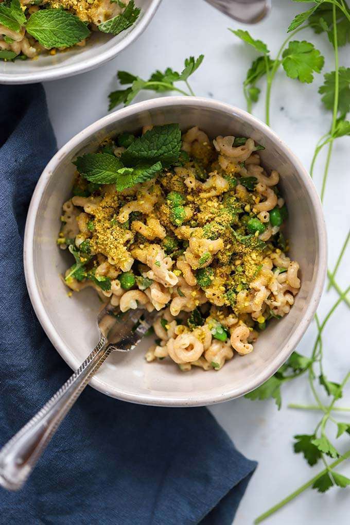 peppermint leaf macaroni in a bowl with a fork in it