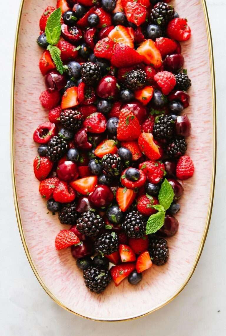 berry platter of strawberries, blackberries, blueberries and raspberries on a plate